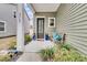 Inviting front porch with a bench and potted plants at 3765 Sawmill Ct, Mount Pleasant, SC 29429