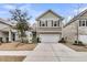 Two-story house with a green exterior, white garage door, and landscaping at 3765 Sawmill Ct, Mount Pleasant, SC 29429