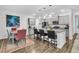 Modern kitchen with gray cabinets, granite countertops, and a breakfast bar at 3765 Sawmill Ct, Mount Pleasant, SC 29429