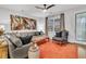 Relaxing living room with sectional sofa, armchair, and large artwork at 3765 Sawmill Ct, Mount Pleasant, SC 29429