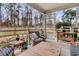 Outdoor screened porch with comfortable seating and wooden furniture at 3765 Sawmill Ct, Mount Pleasant, SC 29429