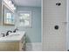Bathroom features a double vanity, marble floors, and a tiled shower at 4329 Spur St, North Charleston, SC 29405