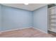 Bedroom with new wood floors, fresh paint and a built-in shelving unit at 4329 Spur St, North Charleston, SC 29405