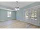 Dining area features stylish light fixture and access to the outdoor patio at 4329 Spur St, North Charleston, SC 29405