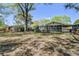 Home exterior with a screened porch and lush landscaping, offering a serene and inviting ambiance at 4329 Spur St, North Charleston, SC 29405