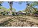 Charming home exterior with a screened porch and lush greenery, creating a welcoming atmosphere at 4329 Spur St, North Charleston, SC 29405