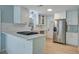 Modern kitchen features white subway tile backsplash, stainless steel appliances and new cabinetry at 4329 Spur St, North Charleston, SC 29405