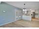 Open dining area leads to the kitchen and its modern appliances and white cabinetry at 4329 Spur St, North Charleston, SC 29405