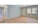 Bright living room boasts new wood floors, fresh paint and plenty of natural light at 4329 Spur St, North Charleston, SC 29405