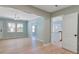 Living room leading to dining and kitchen, with fresh paint and new light wood flooring at 4329 Spur St, North Charleston, SC 29405