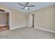 Spacious bedroom with ceiling fan and access to a bathroom and hallway at 517 Travelers Blvd, Summerville, SC 29485