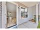 Front entry with light flooring and view into living room at 517 Travelers Blvd, Summerville, SC 29485