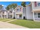 Gray townhouses with red accents and a well-maintained lawn at 517 Travelers Blvd, Summerville, SC 29485