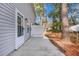 Private patio with adjacent fenced yard and wooded area at 517 Travelers Blvd, Summerville, SC 29485