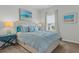 Bright bedroom with light blue bedding and window at 534 Mclernon Trace, Johns Island, SC 29455