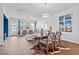 Open concept dining area with a wood table and cowhide rug at 534 Mclernon Trace, Johns Island, SC 29455