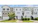Three-story townhouses with attached garages and manicured lawns at 534 Mclernon Trace, Johns Island, SC 29455