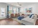 Bright living room with comfortable sectional sofa and large windows at 534 Mclernon Trace, Johns Island, SC 29455