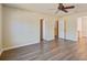 Spacious bedroom with hardwood floors and ceiling fan at 109 Red Leaf Blvd, Moncks Corner, SC 29461