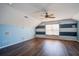 Spacious bedroom with blue and white accent walls, ceiling fan, and hardwood floors at 109 Red Leaf Blvd, Moncks Corner, SC 29461