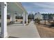 Covered patio area with picnic tables and walkway at 109 Red Leaf Blvd, Moncks Corner, SC 29461