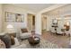 Spacious living room with hardwood floors, fireplace, and staged furniture at 109 Red Leaf Blvd, Moncks Corner, SC 29461