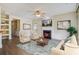 Living room with fireplace, built-in shelves, and hardwood floors at 109 Red Leaf Blvd, Moncks Corner, SC 29461