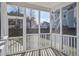 Relaxing screened porch with white railings and backyard views at 109 Red Leaf Blvd, Moncks Corner, SC 29461