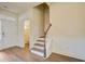 View of a staircase with hardwood floors and a half-bathroom at 109 Red Leaf Blvd, Moncks Corner, SC 29461