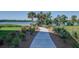 Paved walkway leading to a scenic waterfront deck at 109 Red Leaf Blvd, Moncks Corner, SC 29461