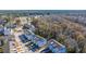 Aerial view of three-story townhome with gray siding, and gray roof shingles at 113 Claret Cup Way, Charleston, SC 29414