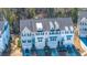 Aerial view of three-story townhome with gray siding, and gray roof shingles at 113 Claret Cup Way, Charleston, SC 29414