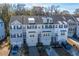 Aerial view of three-story townhome with gray siding, and gray roof shingles at 113 Claret Cup Way, Charleston, SC 29414