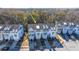 Aerial view of townhome community showcasing a three-story townhome with gray siding at 113 Claret Cup Way, Charleston, SC 29414