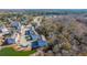 Aerial view of three-story townhome with gray siding, and gray roof shingles at 113 Claret Cup Way, Charleston, SC 29414