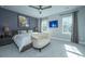 Large bedroom with plush bedding and sitting area at 113 Claret Cup Way, Charleston, SC 29414