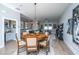 Open concept dining area with a round table and chairs, and views into the living area and kitchen at 113 Claret Cup Way, Charleston, SC 29414