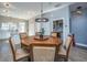 Round wooden dining table with six cushioned chairs at 113 Claret Cup Way, Charleston, SC 29414