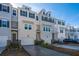 Three-story townhome with gray siding, white trim, and attached garage at 113 Claret Cup Way, Charleston, SC 29414