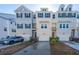 Three-unit townhome building with attached garages and landscaping at 113 Claret Cup Way, Charleston, SC 29414