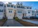 Three-story townhome with gray siding, white trim, and attached garage at 113 Claret Cup Way, Charleston, SC 29414