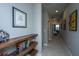 Bright hallway with built-in shelves and framed artwork at 113 Claret Cup Way, Charleston, SC 29414