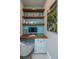 Charming home office features built-in shelves and a light blue accent wall at 113 Claret Cup Way, Charleston, SC 29414