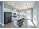 Modern kitchen with stainless steel appliances, white cabinets, and a large island at 113 Claret Cup Way, Charleston, SC 29414
