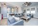 Relaxing living area with gray sofas and a ceiling fan at 113 Claret Cup Way, Charleston, SC 29414