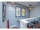 Upstairs hallway with gray shiplap walls and playful art at 113 Claret Cup Way, Charleston, SC 29414