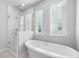 Spa-like bathroom with soaking tub and walk-in shower at 117 Wonder Sol Way, Summerville, SC 29485