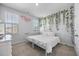 Spacious bedroom featuring a white metal bed frame and a plant wall at 117 Wonder Sol Way, Summerville, SC 29485