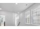 Bright hallway with several windows and recessed lighting at 117 Wonder Sol Way, Summerville, SC 29485