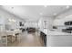 Open concept kitchen with island and adjacent living area at 117 Wonder Sol Way, Summerville, SC 29485